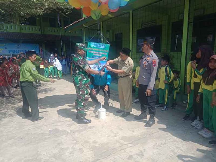 Danramil 11 Punggelan Hadiri Pembukaan Porseni MI Tingkat Kecamatan Punggelan